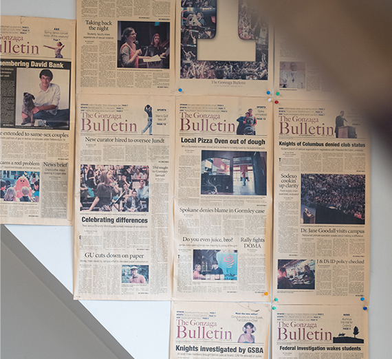 A professor and student look at a computer screen in a laboratory